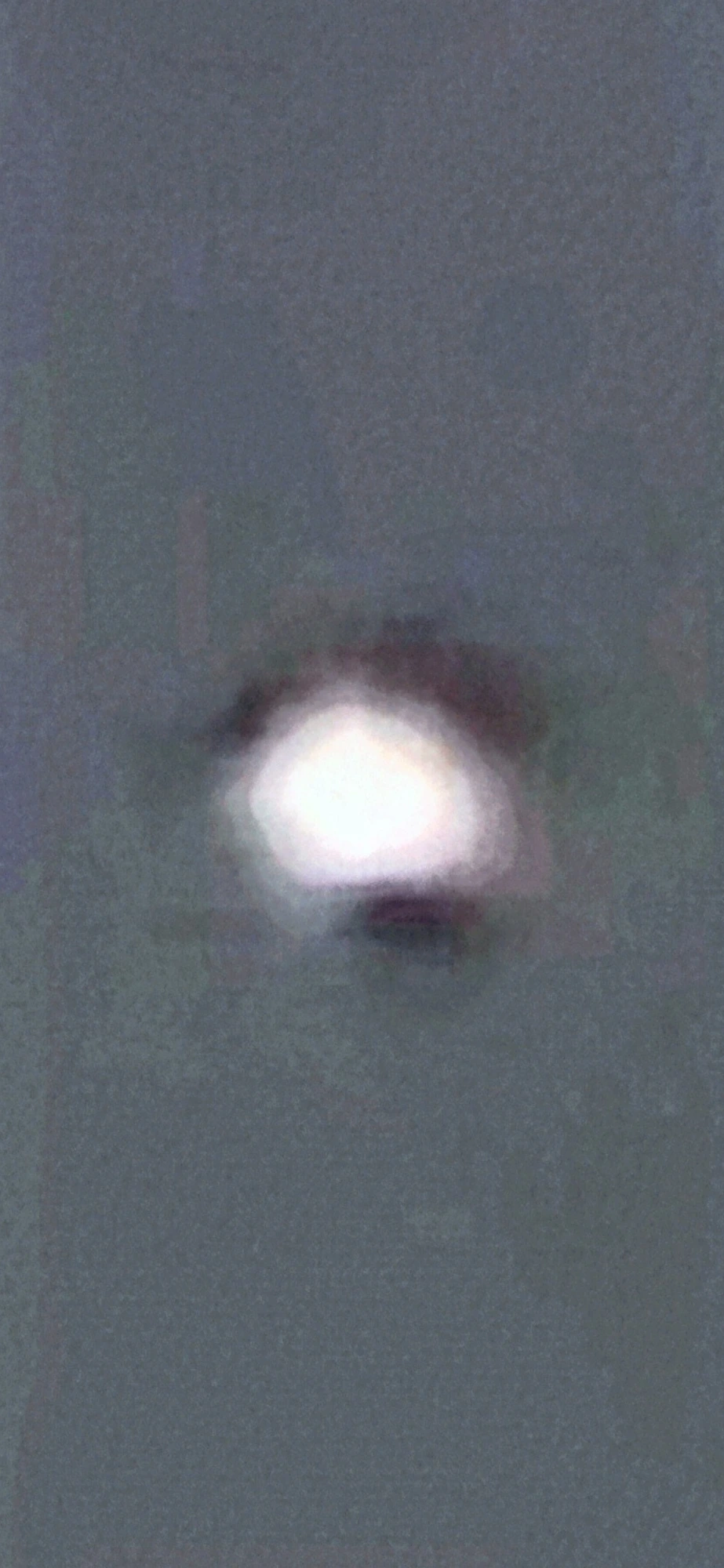 Fourth zoom frame — the black anomaly on the surface of the illuminated orb is undeniable: a solid dark band across the top hemisphere and a solid dark oval attached to the bottom, with the same non-stellar outline